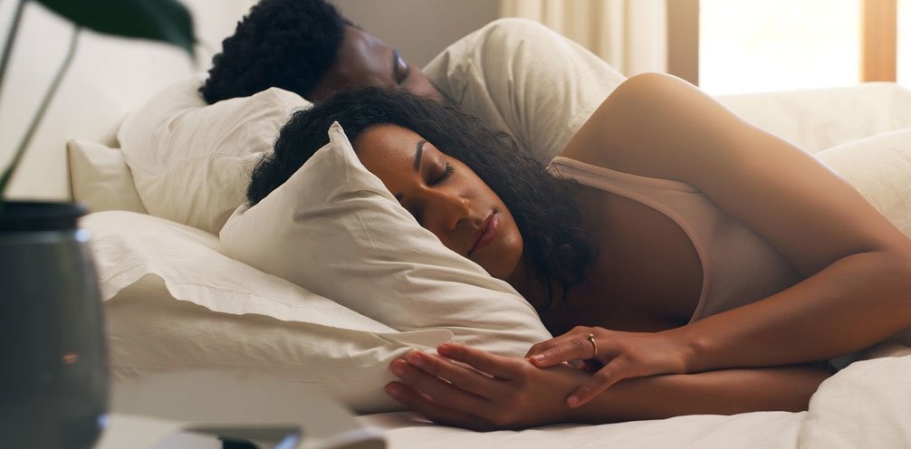 Africian american couple sleeping