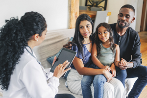 Pediatrician talking to family.